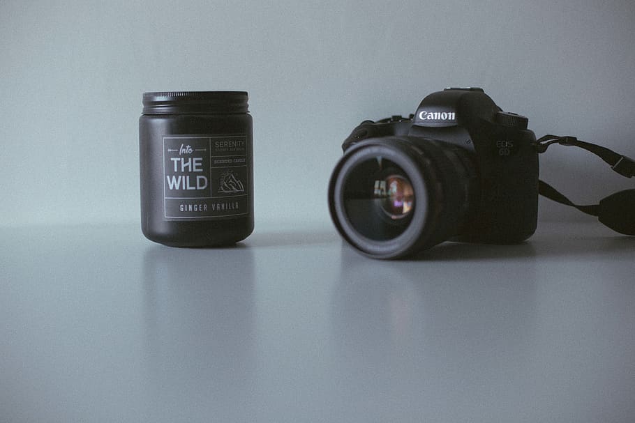 black-canon-dslr-camera-near-black-the-wild-plastic-bottle.jpg