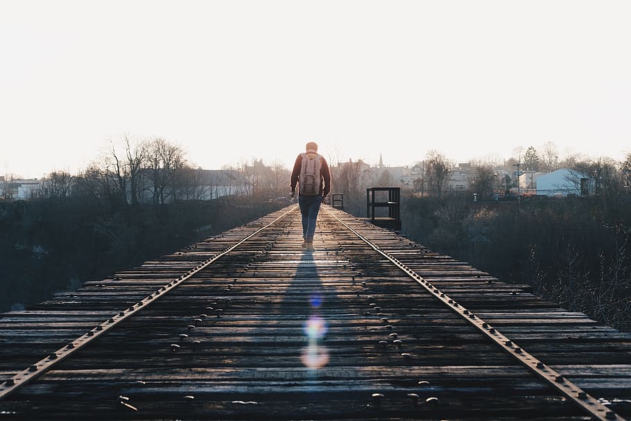 guy, man, people, bridge, wood, walking, sun rays, sunlight HD wallpaper