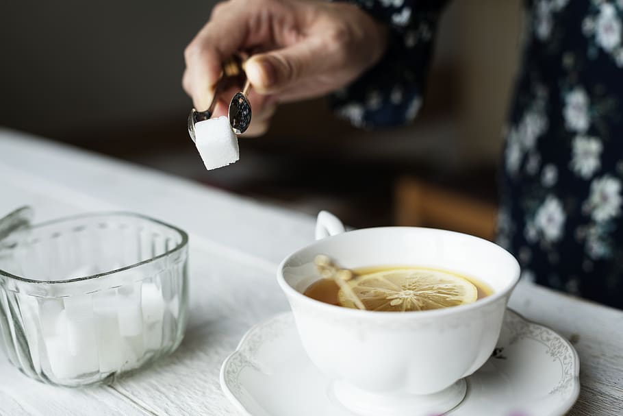 White Ceramic Teacup With Liquad, drink, hand, hot, lemon, lemon tea HD wallpaper
