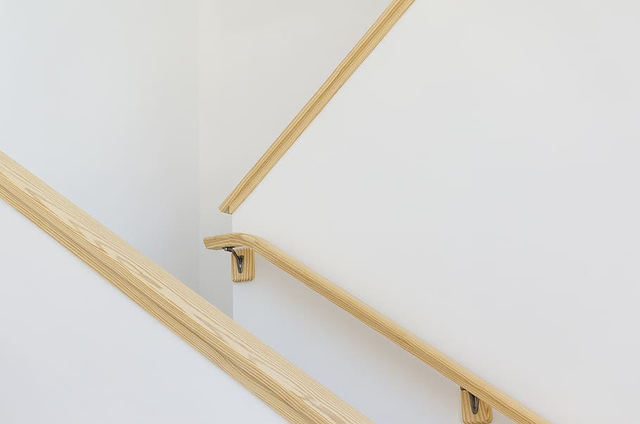 closeup photography of white painted walls, handrail, wooden