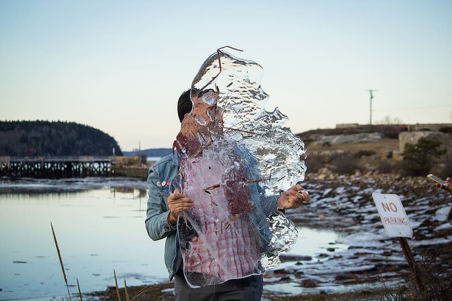 person holding ice, water, human, outdoors, finger, pants, apparel HD wallpaper