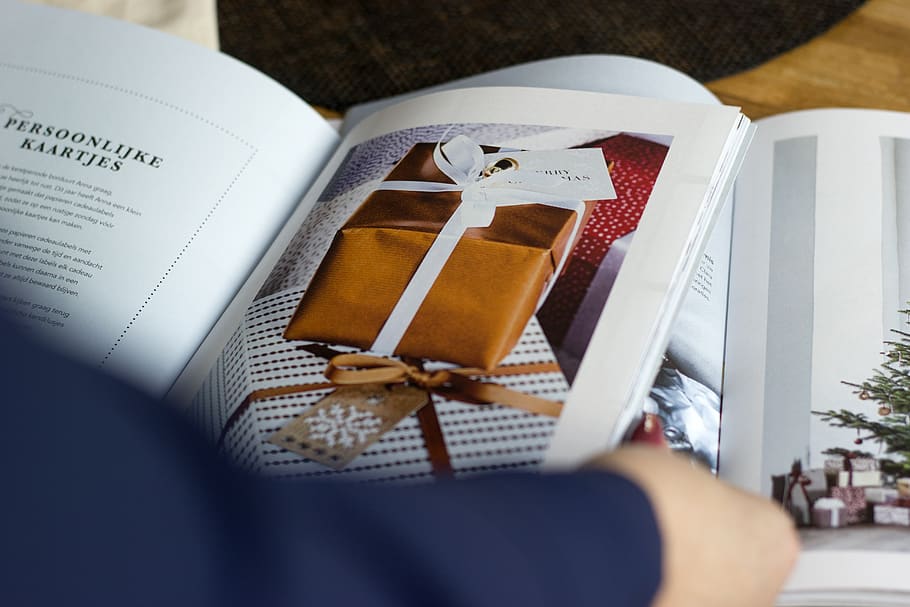 gift box graphic book, one person, human body part, paper, holding HD wallpaper