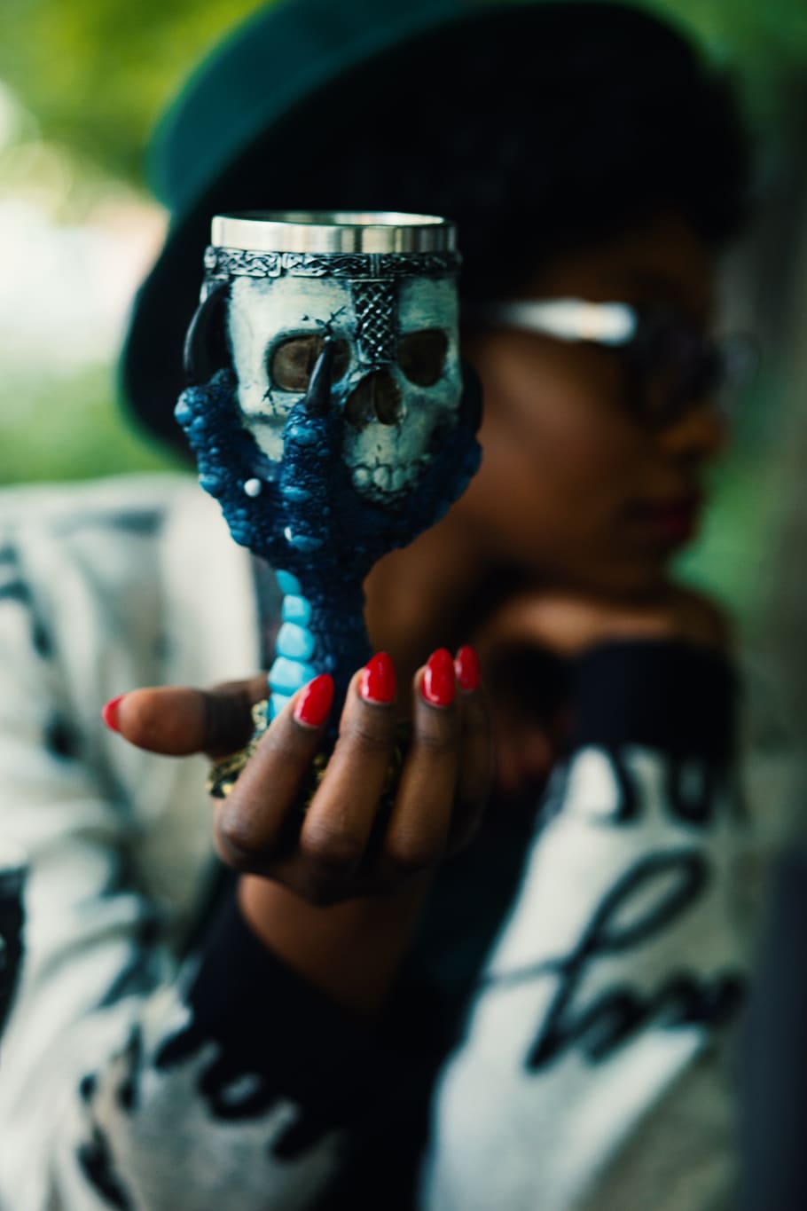 Person Holding Skull and Bird Claw Goblet, cup, hand, woman, human hand HD wallpaper