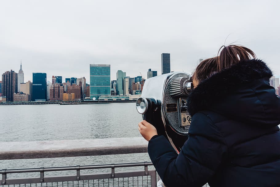 woman using telescope, human, person, railing, city, camera, electronics