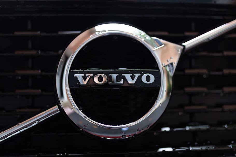 Volvo emblem, focus on foreground, close-up, indoors, metal, no people HD wallpaper