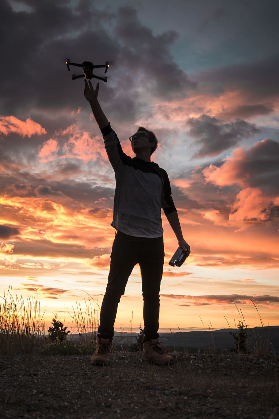 silhouette photo of man holding up drone, sunset, sky, cloud - sky, HD wallpaper