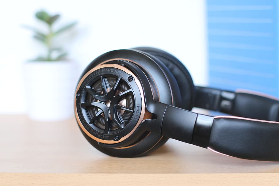 black headphones, table, indoors, no people, close-up, focus on foreground HD wallpaper