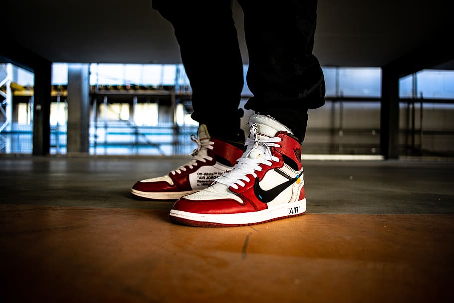 Person Wearing White Red And Black Nike X Off White Air Jordan 1 S 