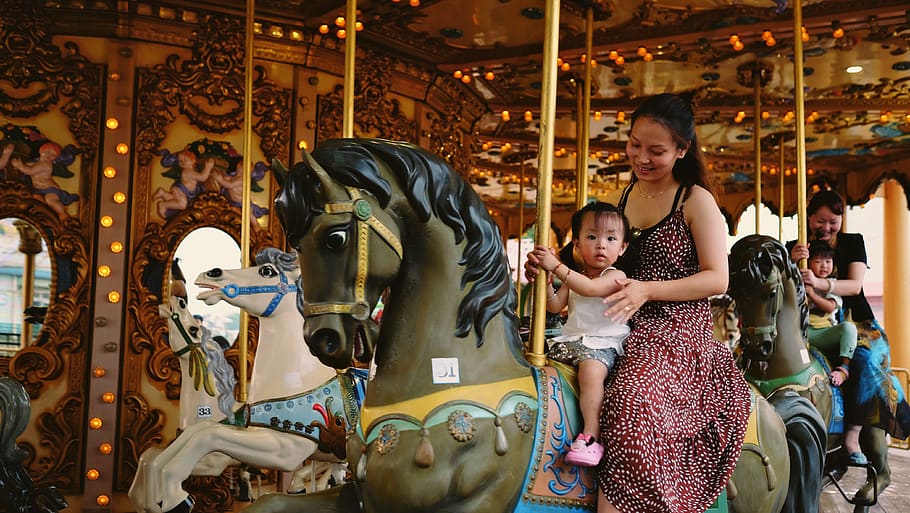 child and woman riding horse carousel, amusement park, person, HD wallpaper