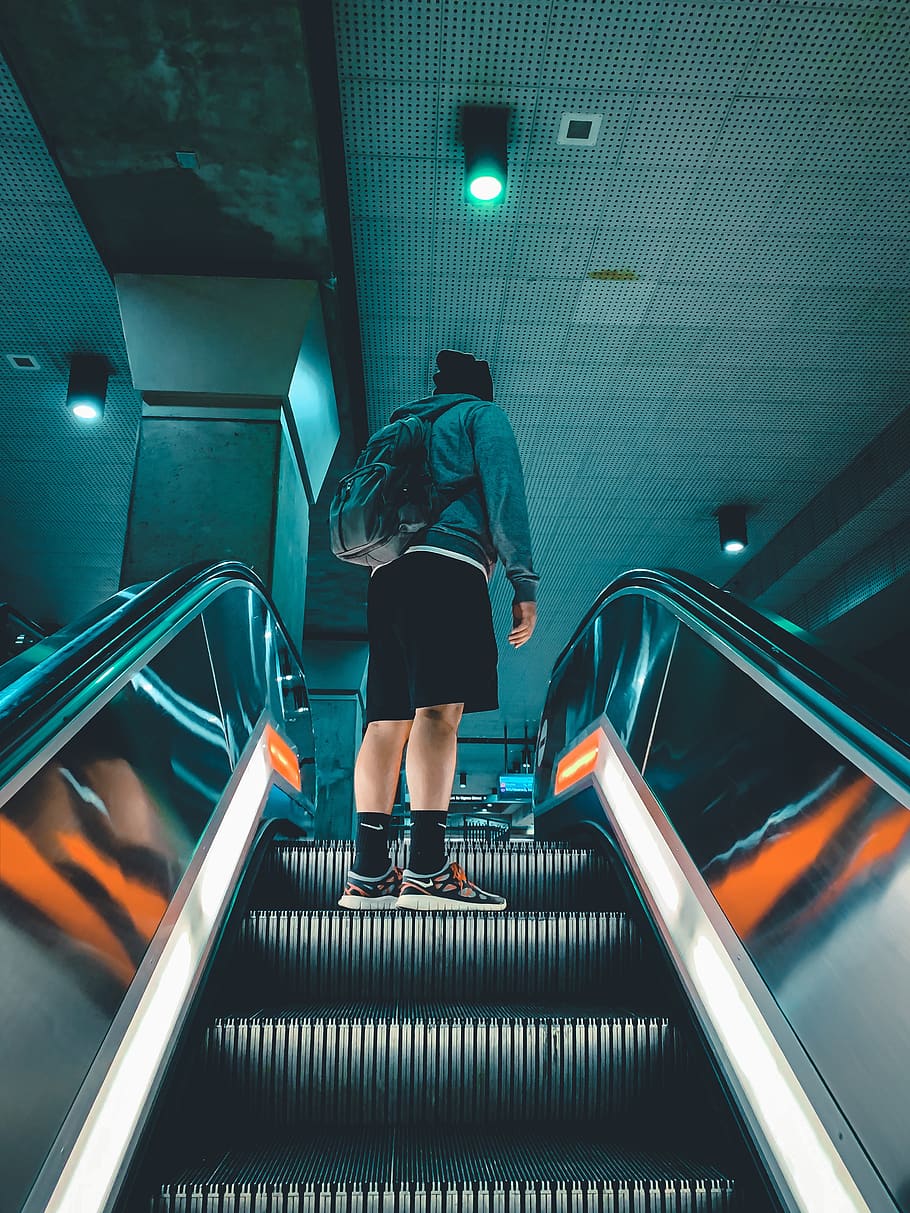 man in jacket standing on escalator, banister, handrail, person HD wallpaper
