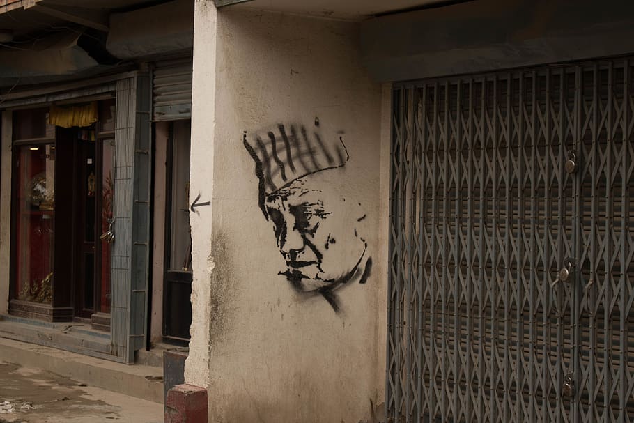 man graffiti on wall by close buildding, tattoo, skin, home decor