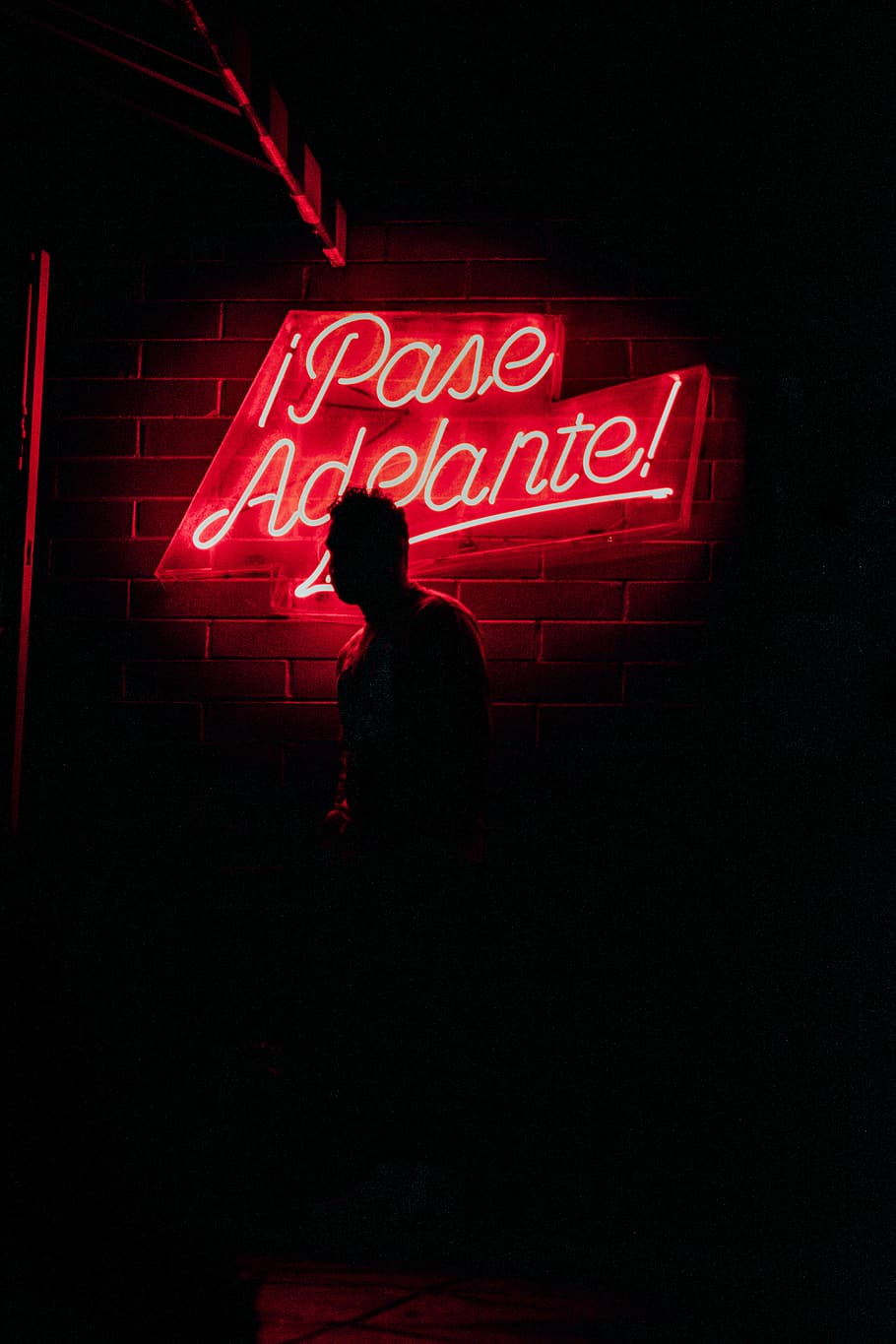 silhouette-of-person-by-neon-signage.jpg