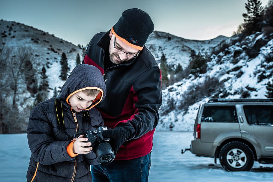 Man and Boy Looking at Dslr Camera, cold, daylight, daytime, environment HD wallpaper