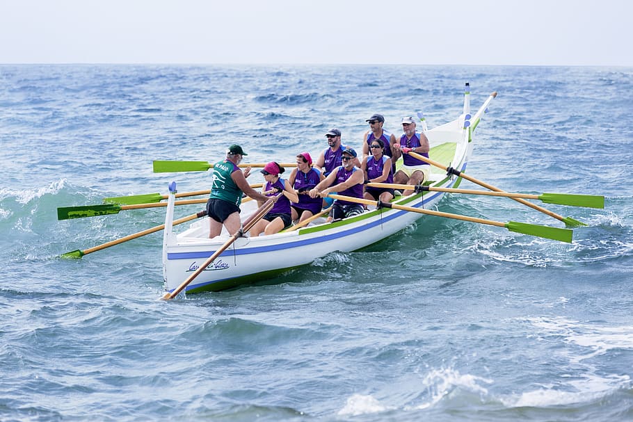 people paddling on sea, human, person, boat, transportation, vessel