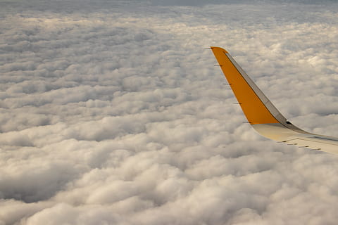 yellow airplane tail on white clouds, nature, flying, vehicle HD wallpaper