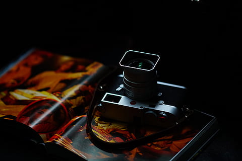 grey camera on book page, electronics, light, magazine, lens HD wallpaper