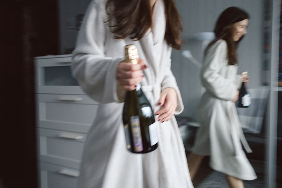 HD wallpaper: Photo of Woman in White Robe Carrying a Wine Bottle ...