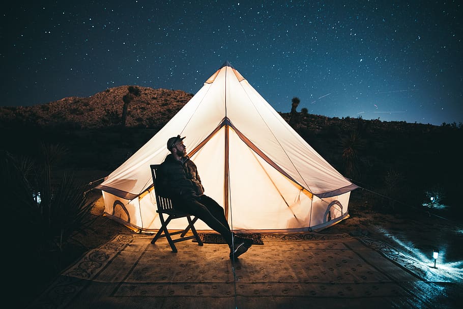 man sitting by tent with light, night, star - space, one person HD wallpaper