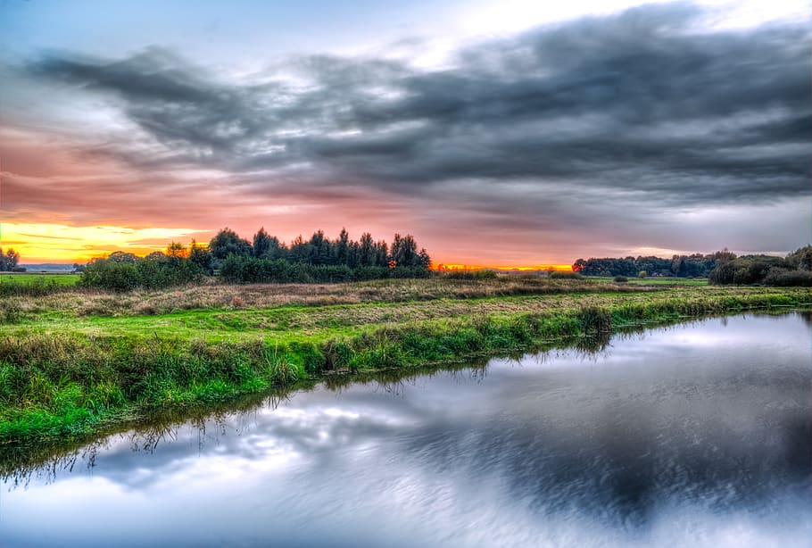 Green Field Near Body of Water during Daytime, clouds, dawn, grass HD wallpaper