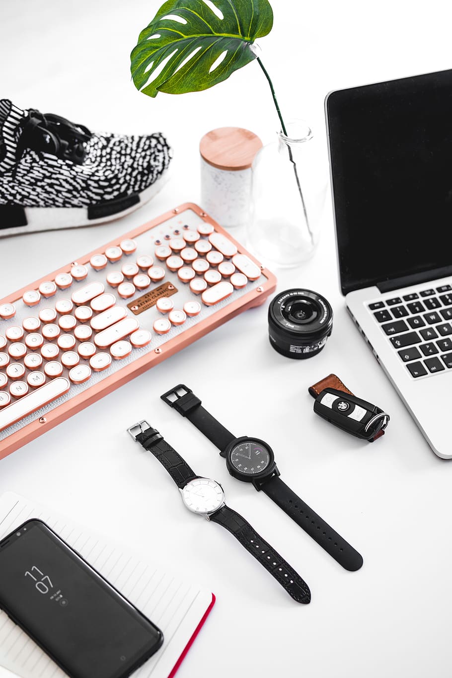 two round black analog watches, macbook pro, wristwatch, desk setup