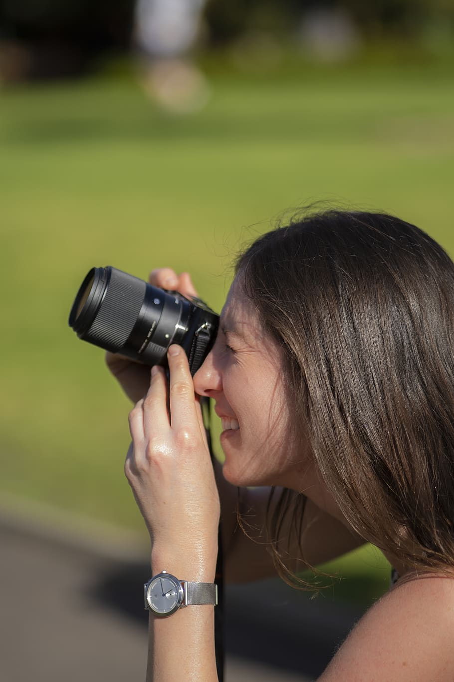 Woman Holding Camera in Bokeh Photography, blurred background HD wallpaper
