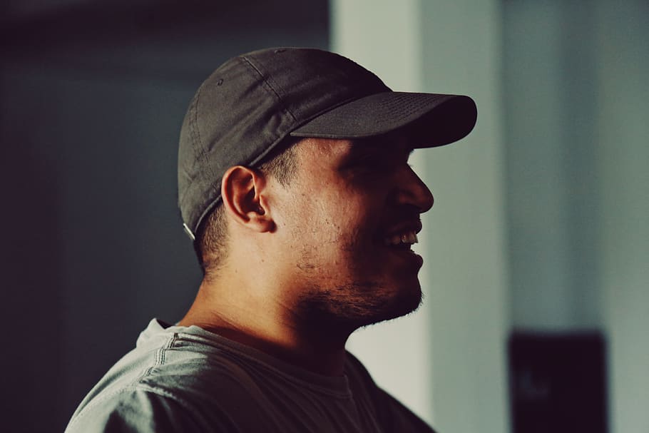 man wearing black baseball cap, human, people, person, hole, grey HD wallpaper