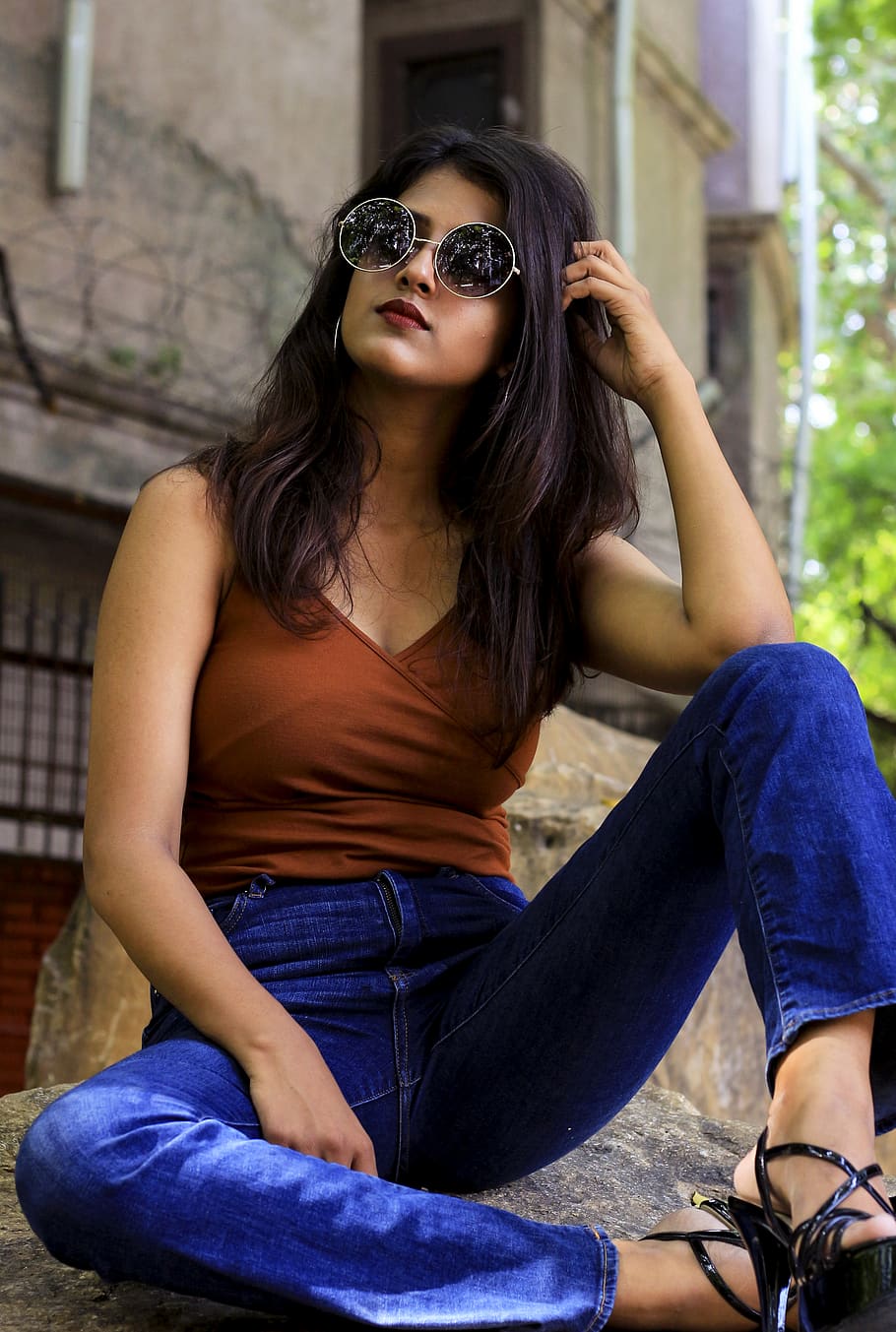 Portrait of a young beautiful girl in sunglasses close-up. Model poses on a  warm spring evening Stock Photo - Alamy