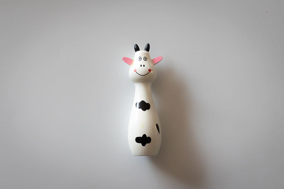 White and Black Cow Figurine, art, conceptual, cute, doll, fun HD wallpaper