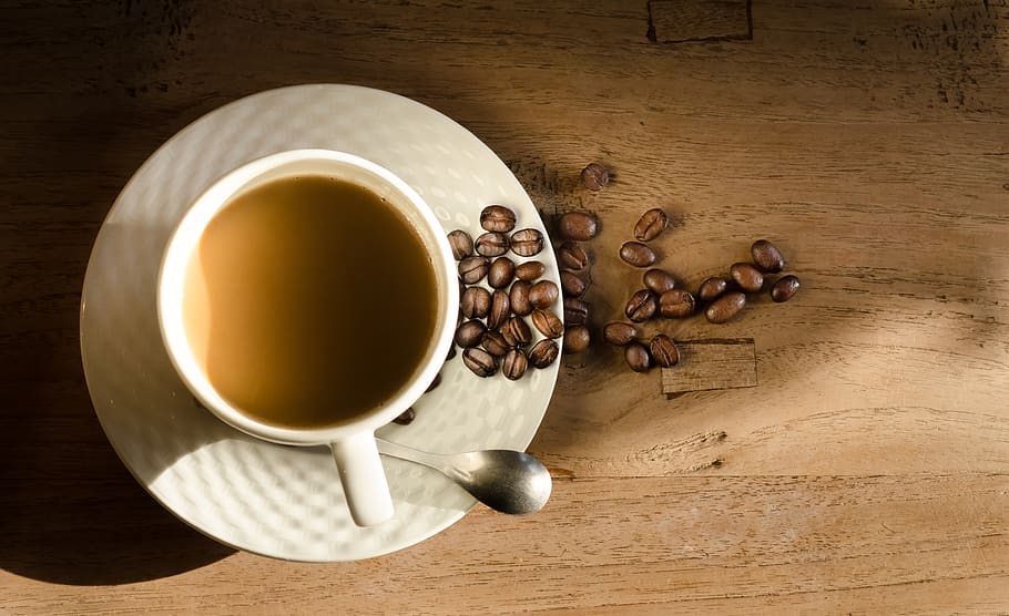 Teacup in Saucer Beside Coffee Beans and Spoon, caffeine, close-up HD wallpaper