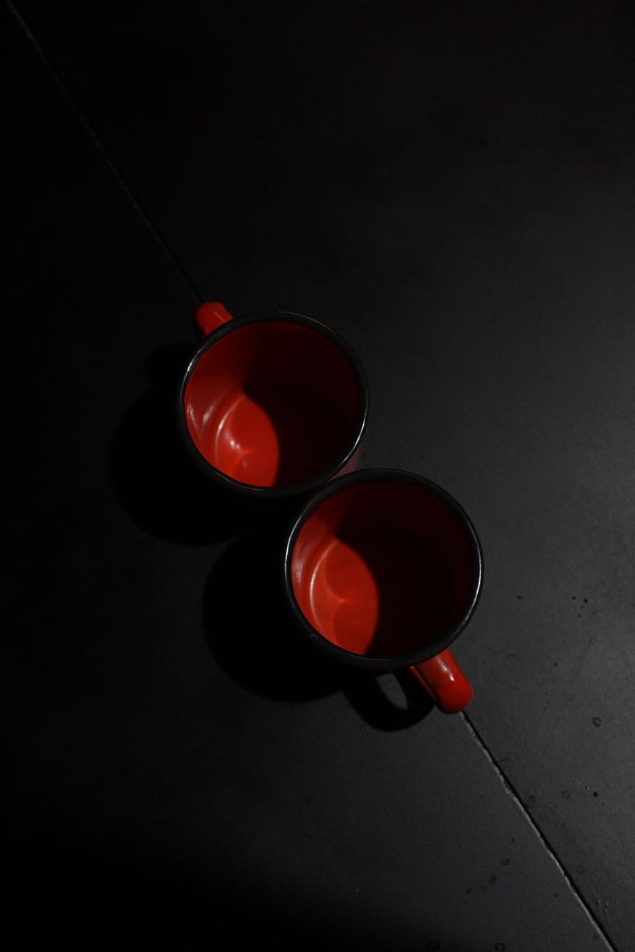 Two Red Ceramic Mugs on Black Surface, color, cups, metallic mugs HD wallpaper