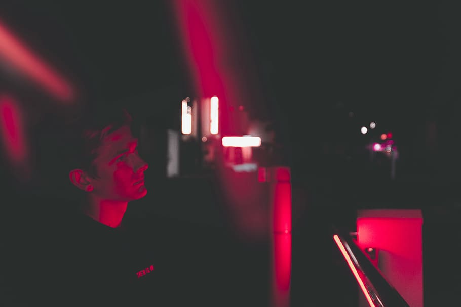 man inside dimmed lighted room, neon, lighting, sarasota, fl