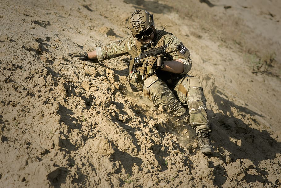 Soldier Sliding Downhill Holding Rifle during Daytime, action, HD wallpaper