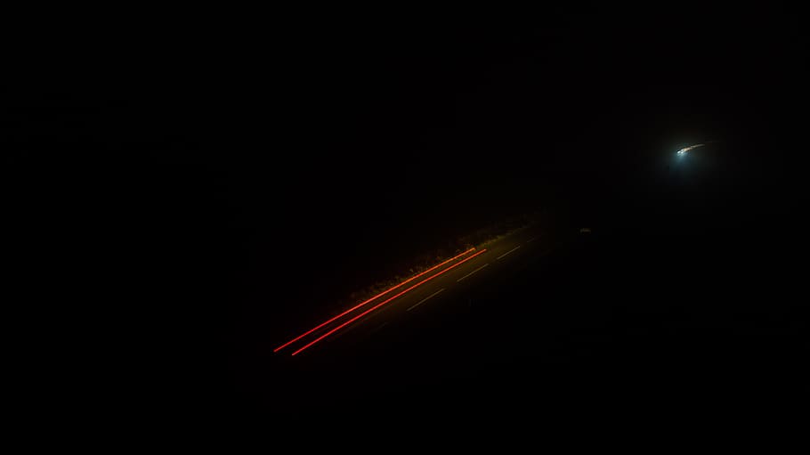 time-lapse photography of moving vehicle on road at night, light