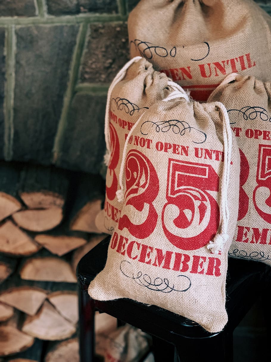 four brown drawstring bags, sack, person, human, christmas, 25 HD wallpaper