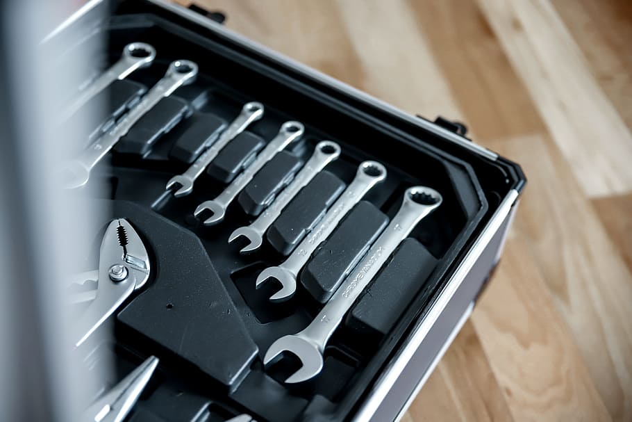 Set of tools in open suitcase, close-up, indoors, technology HD wallpaper