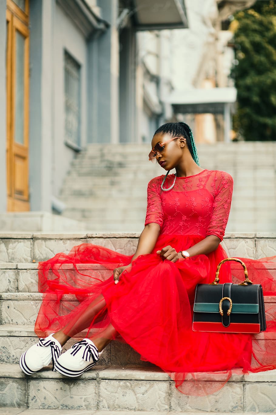 Woman Wearing Red Long-sleeved Dress Near Black Leather Bag Sitting on Concrete Stairs Posing for Photoshoot, HD wallpaper