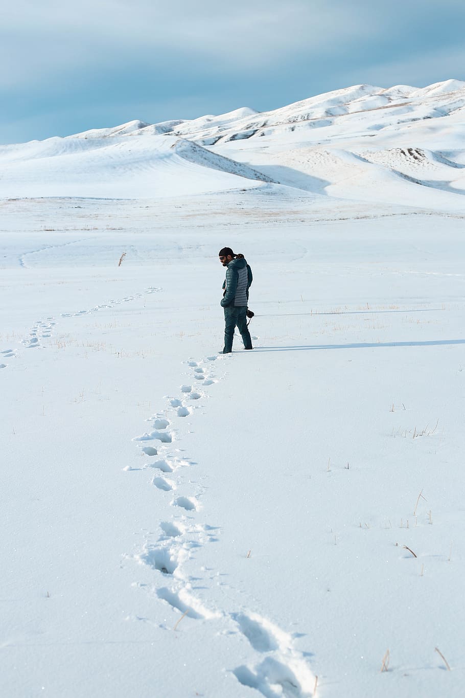 Man Standing on Snow Area, camera, cold, daylight, explore, footprints HD wallpaper