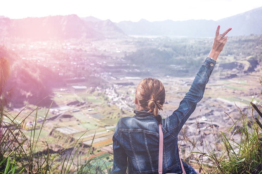 Woman in Denim Jacket Raising Her Hand, cliff, clouds, cloudy HD wallpaper