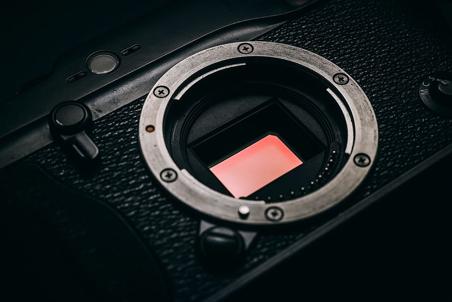 close-up photo of black camera body, sensor, rangefinder, clean