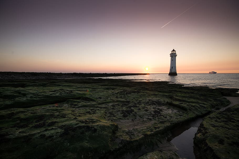lighthouse during golden hour, guidance, sea, sky, water, tower HD wallpaper