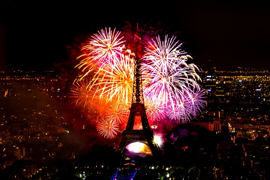 A fireworks display behind the Eiffel Tower in France., paris