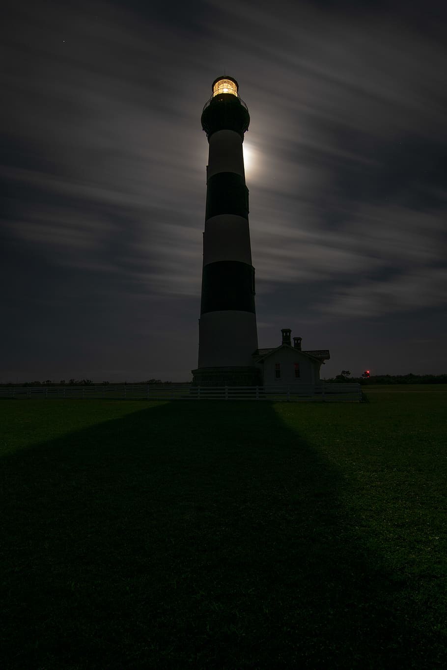 lighthouse under cloudy sky at night, architecture, grass, built structure HD wallpaper