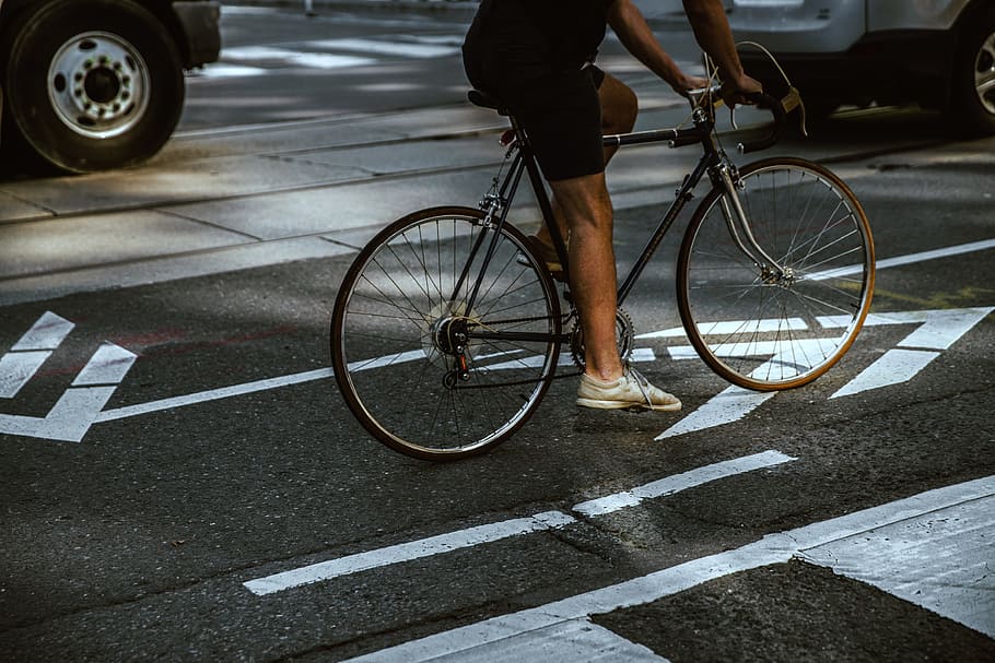 Man Riding In City Bike Lane Photo, Street, transportation, bicycle