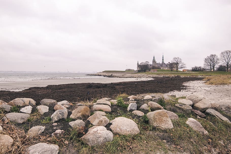seashore during daytime, rubble, ground, rock, denmark, kronsborg castle HD wallpaper