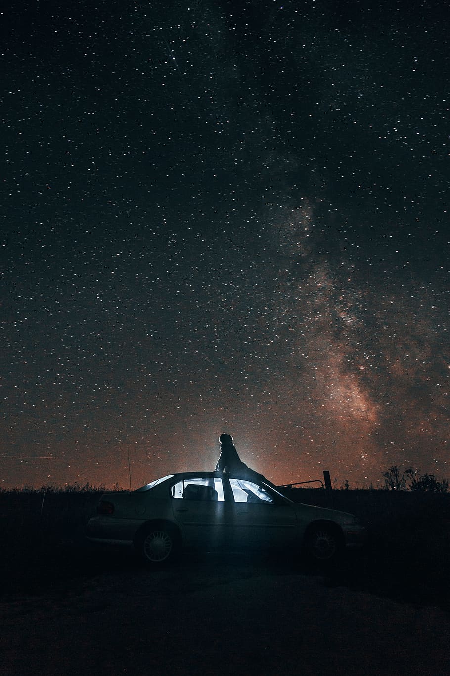 white sedan under blue sky, star, car, person, looking up, galaxy