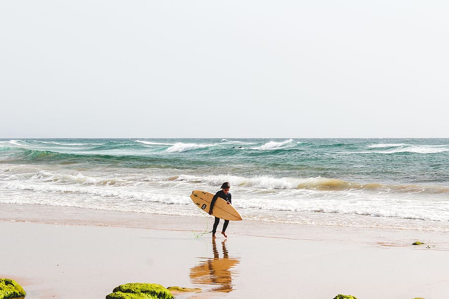 person holding surfboard, sand, wafe, surfer, beach, seascape HD wallpaper