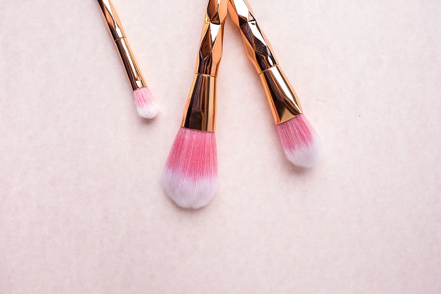 gold-colored makeup brushes, cosmetics, earring, jewelry, ornament