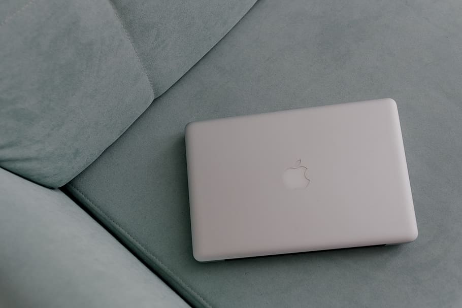 MacBook laptop lying on mint couch, interior, minimal, minimalist HD wallpaper