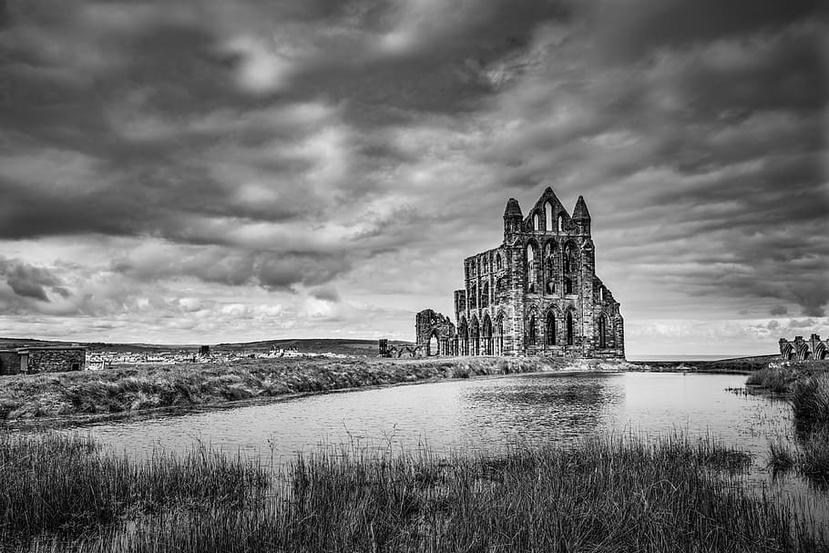 grayscale photography of concrete building under cloudy sky, water HD wallpaper