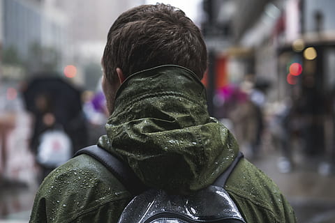 close-up photography of man wearing green hoodie, downtown, perspective HD wallpaper